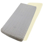 Grey star-patterned and cream cotton jersey crib fitted sheets on a white background