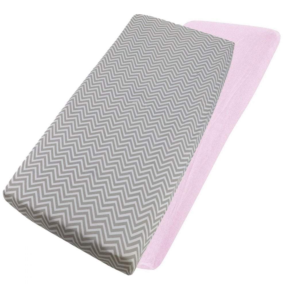 Grey chevron-patterned and pink cotton jersey crib fitted sheets on a white background