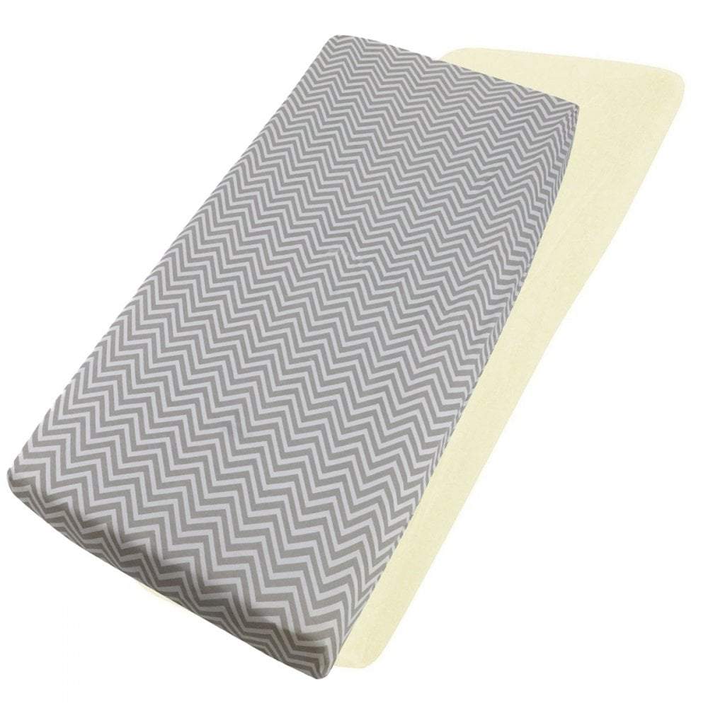 Grey chevron-patterned and cream cotton jersey crib fitted sheets on a white background