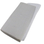 Grey chevron-patterned cotton jersey crib fitted sheet on a white background