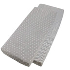 Grey chevron-patterned and grey cotton jersey crib fitted sheets on a white background