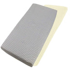 Grey chevron-patterned and cream cotton jersey crib fitted sheets on a white background
