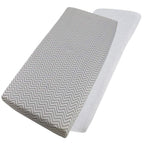 Grey chevron-patterned and white cotton jersey crib fitted sheets on a white background