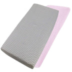 Grey chevron-patterned and pink cotton jersey crib fitted sheets on a white background